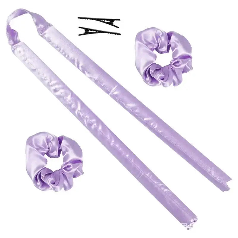 Lavender-colored satin hair accessories including scrunchies, hair sticks, and clips.