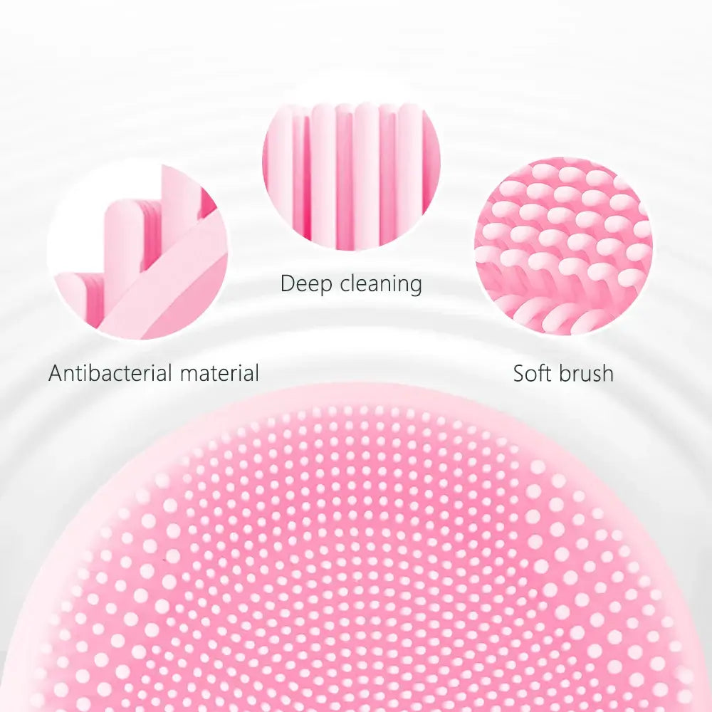 Pink circular silicone facial cleansing brush with textured surface.