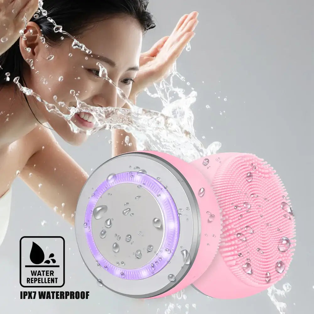 Waterproof facial cleansing brush with LED lights and a pink silicone head.