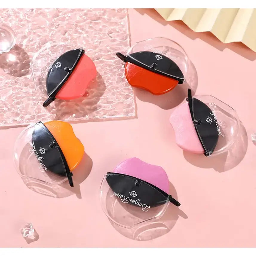 Colorful spherical lip balms with black caps in clear plastic containers.