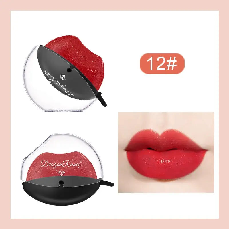 Compact red and black makeup compact with a mirror and corresponding lip color swatch.