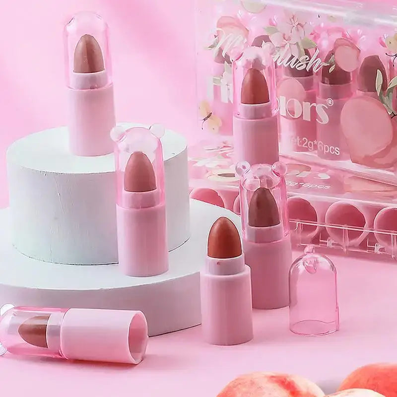 Pink lipsticks in various shades and packaging styles.