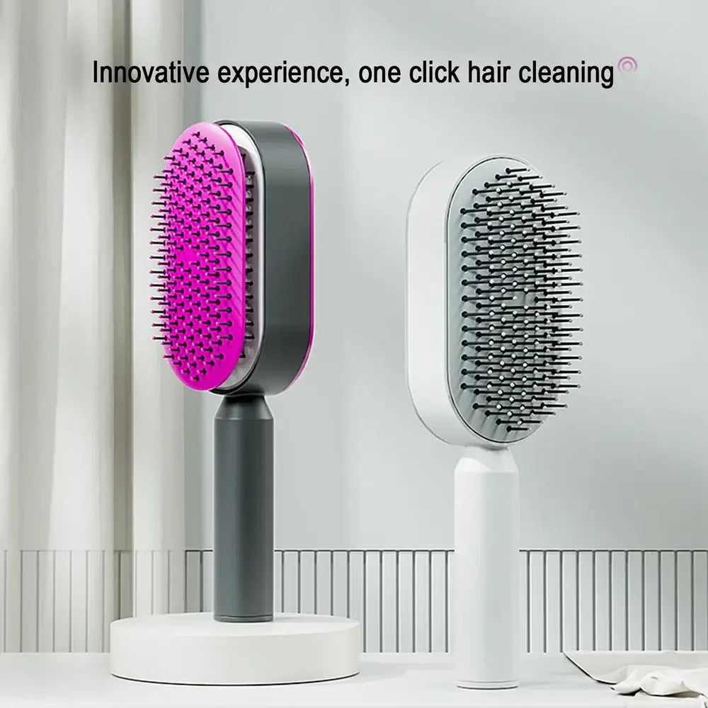 Electric hair brush with a sleek design featuring a pink bristled head and gray handle.