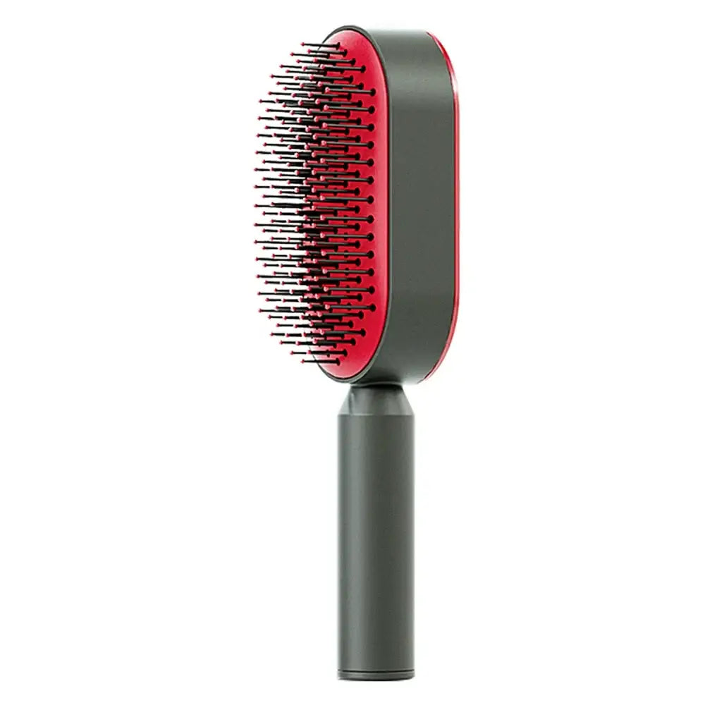 Hair brush with a red paddle and black bristles on a gray handle.