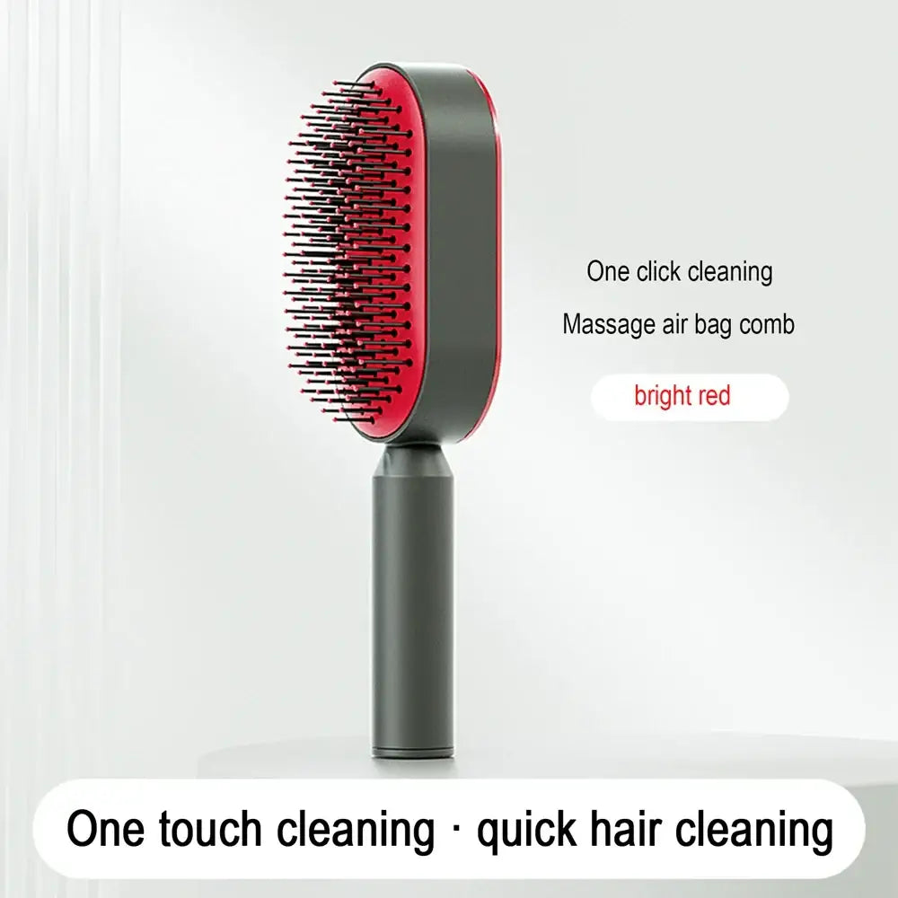 Sleek hairbrush with red bristles and a gray handle.