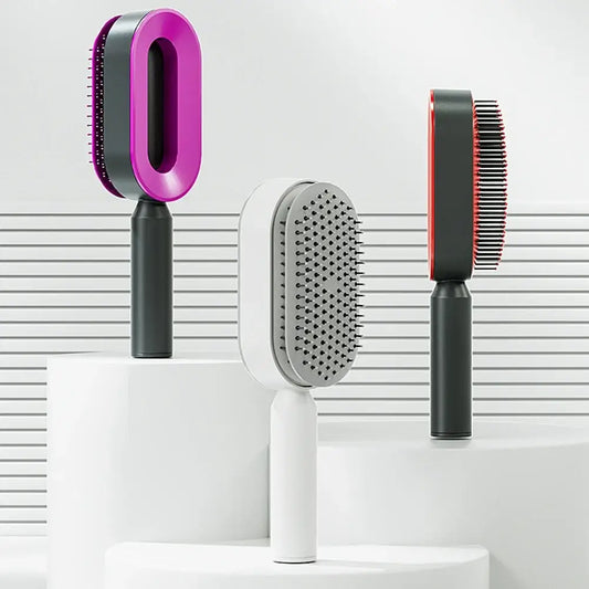 Three different hair brushes or styling tools with distinct designs and colors.