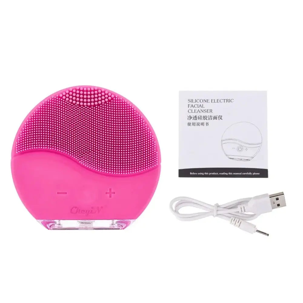 Pink silicone facial cleansing brush with textured surface.