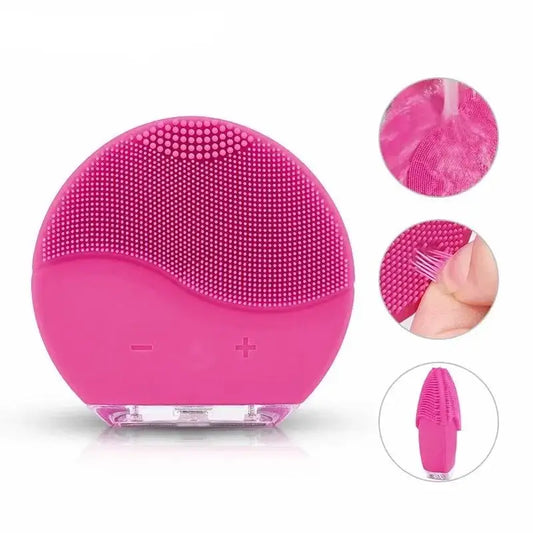 Pink silicone facial cleansing brush with textured surface and rounded shape.