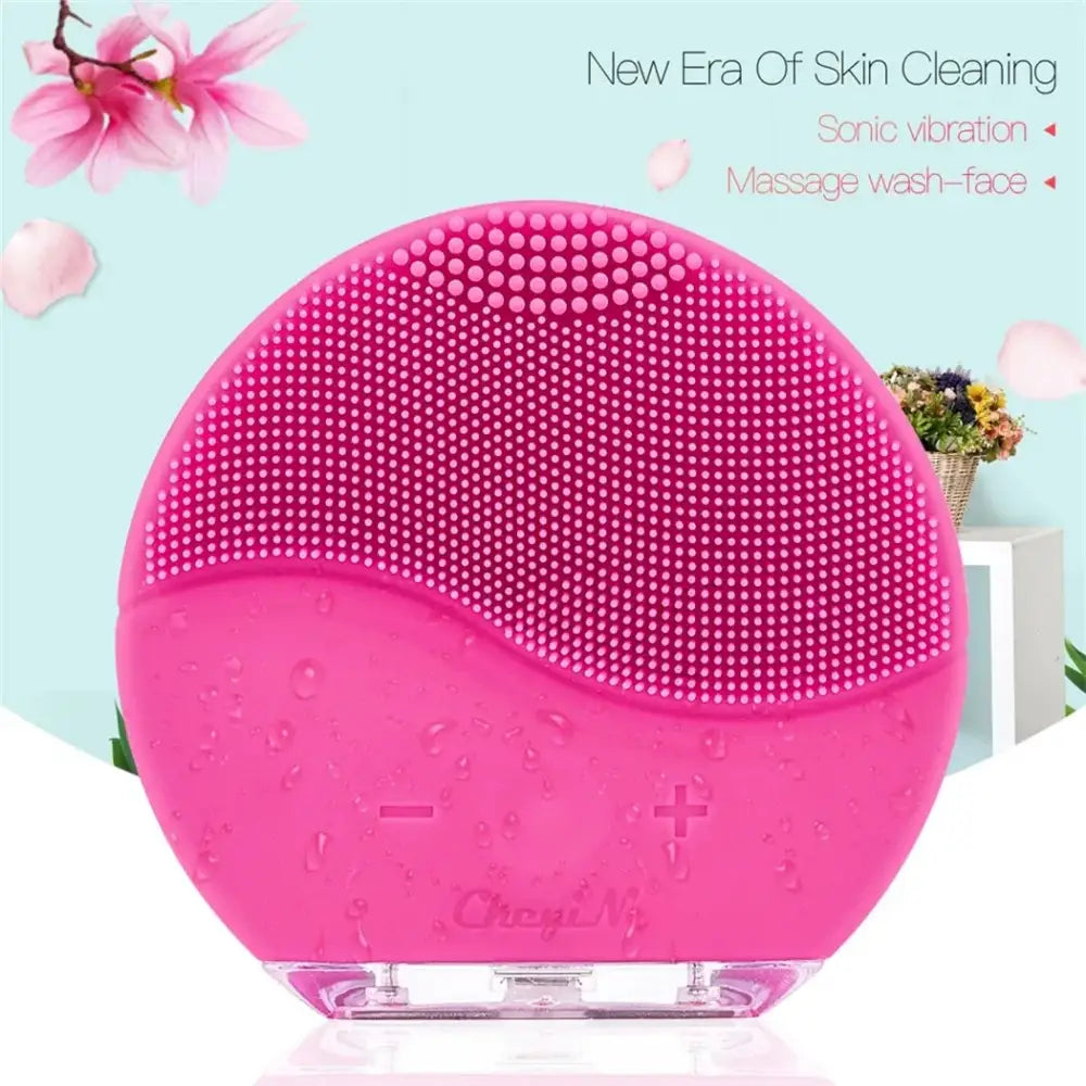 Pink circular facial cleansing brush with silicone bristles.