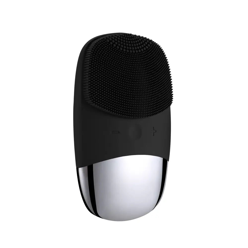 Handheld facial cleansing brush with a black silicone head and silver base.