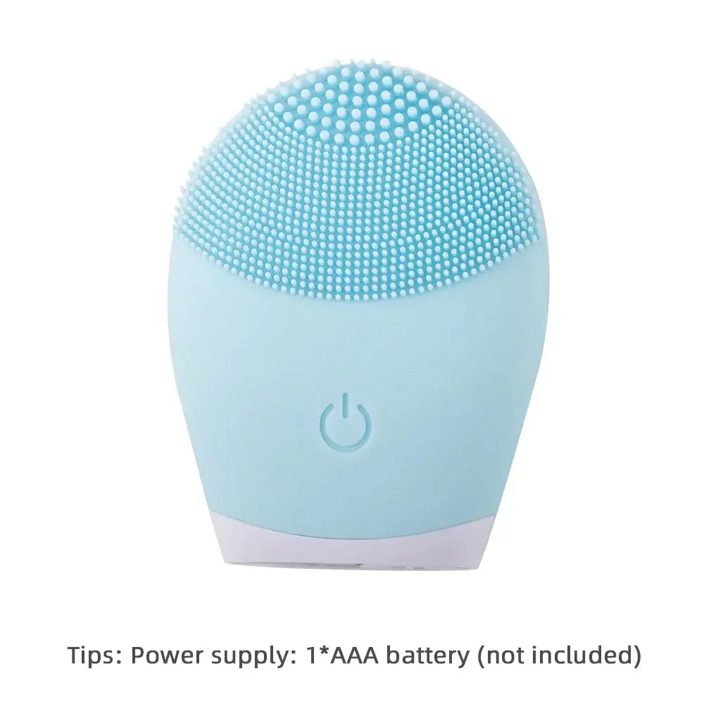 Light blue facial cleansing brush with textured silicone bristles and a power button.