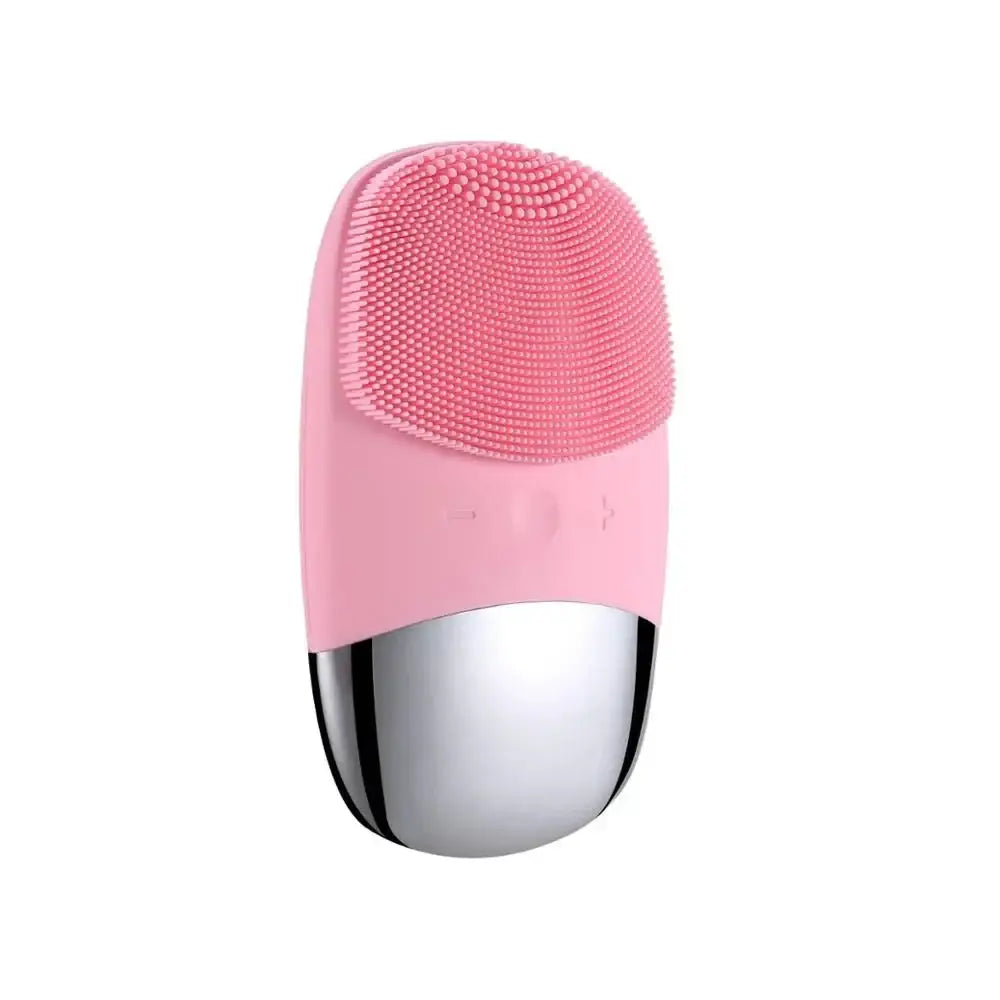 Pink and silver facial cleansing brush with a textured silicone head.