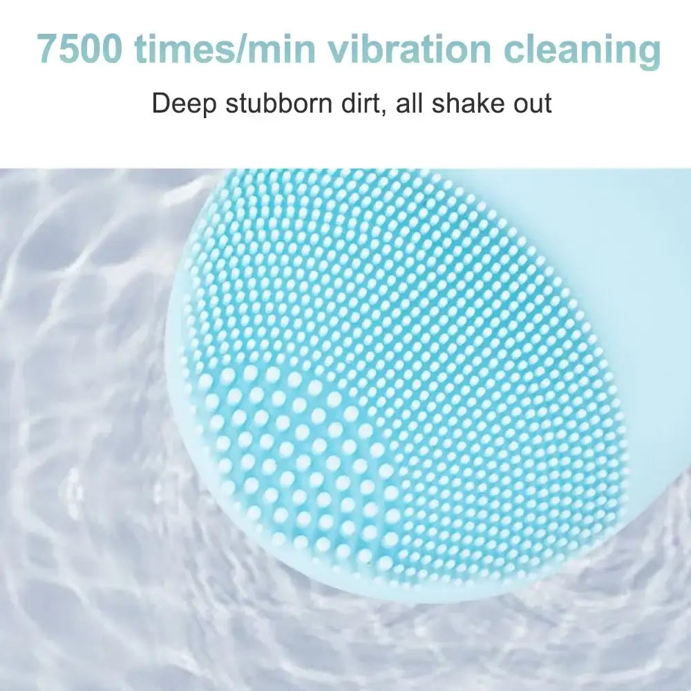 Teal silicone facial cleansing brush with numerous small nubs covering its surface.