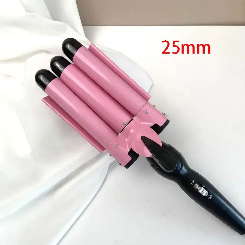 Pink triple-barrel hair curling iron with a black handle.