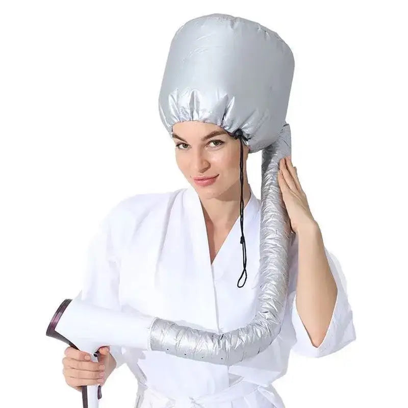 Portable hair dryer bonnet attachment with a flexible hose.