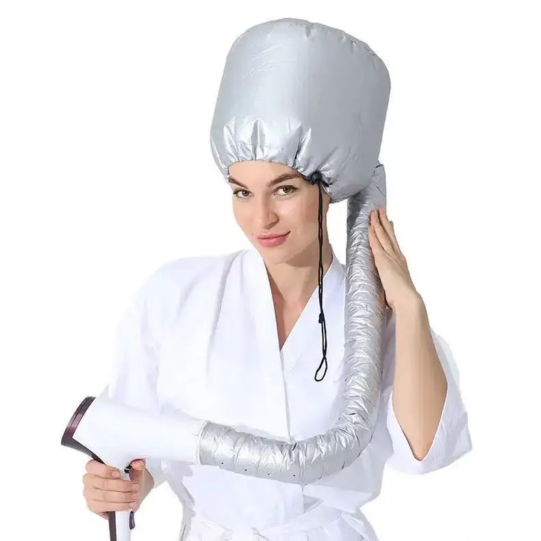 Portable hair dryer bonnet attachment with a flexible hose.