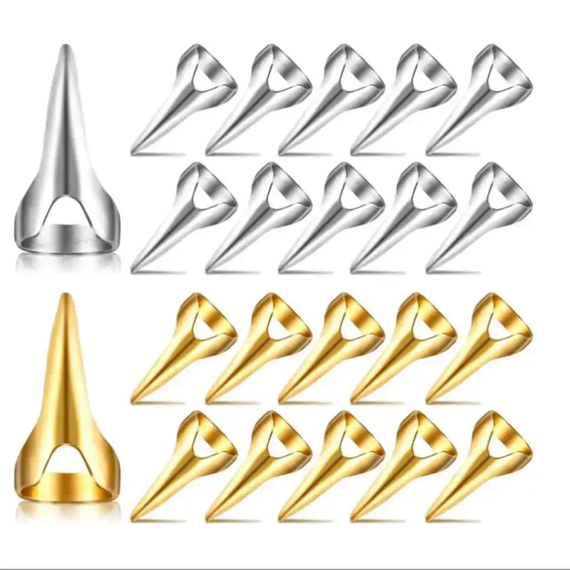 Nose rings or studs in silver and gold colors arranged in rows.