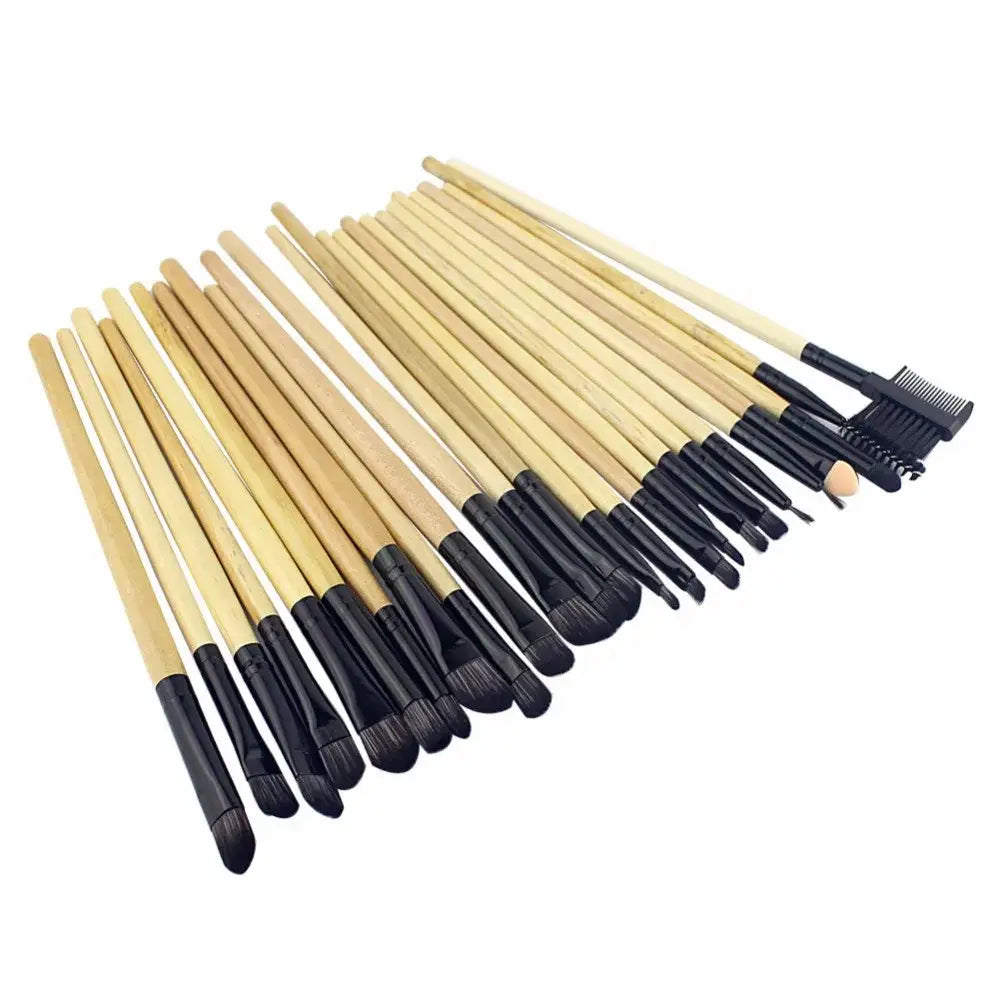 Set of makeup brushes with wooden handles and black bristles.