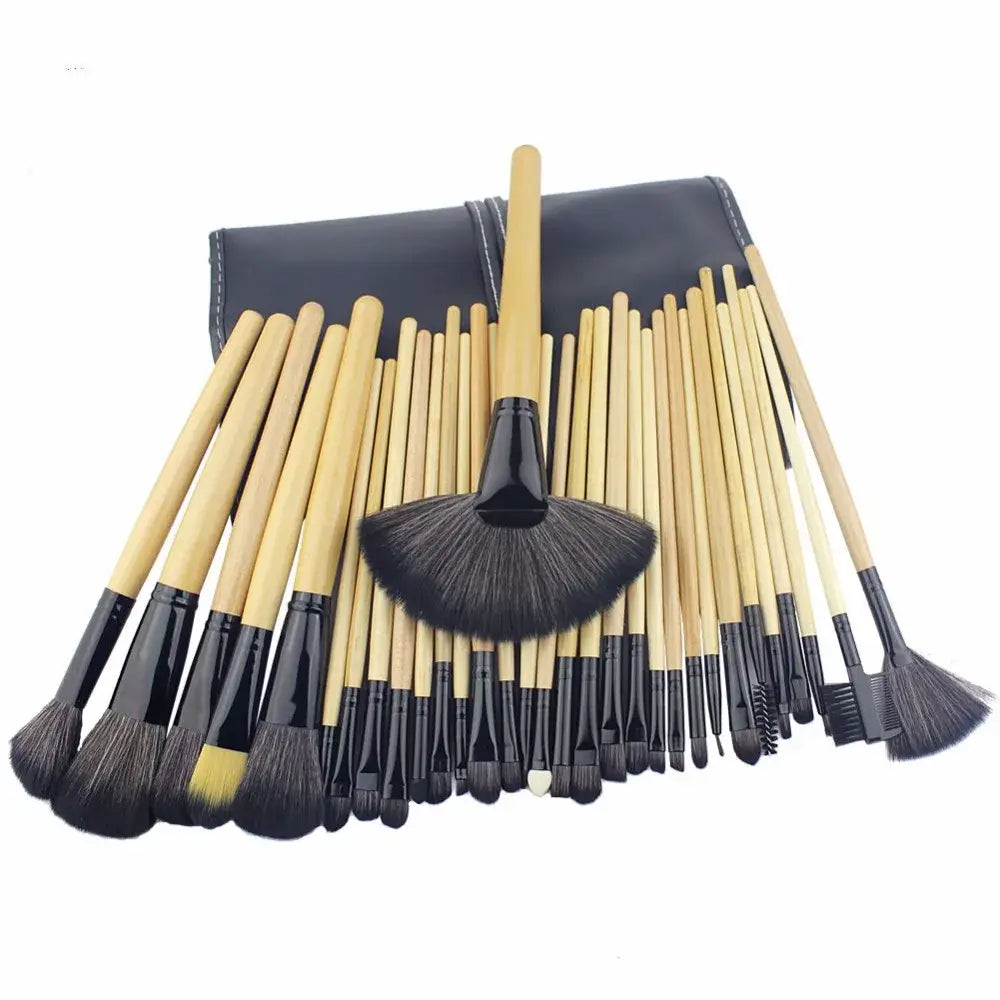 Set of makeup brushes with wooden handles and black bristles arranged in a fan shape.