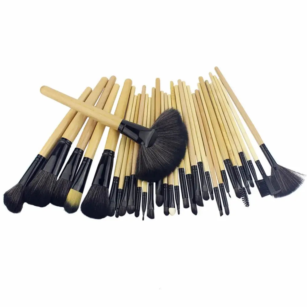 Set of makeup brushes with wooden handles and black bristles.