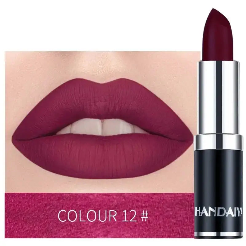 Deep burgundy lipstick with a matching lip swatch.