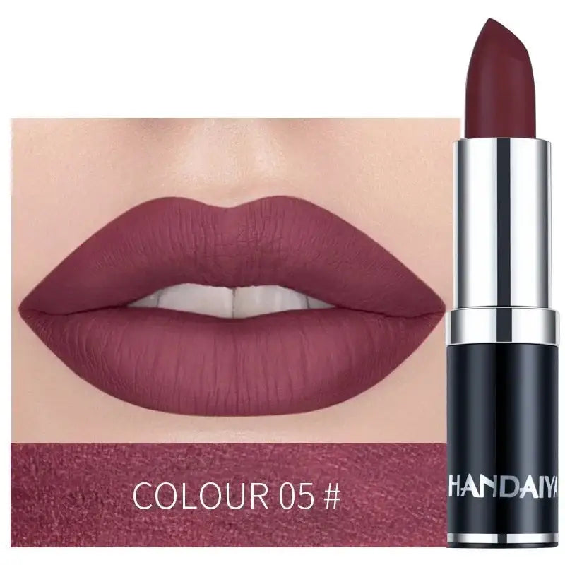 Matte burgundy lipstick with matching lip swatch.