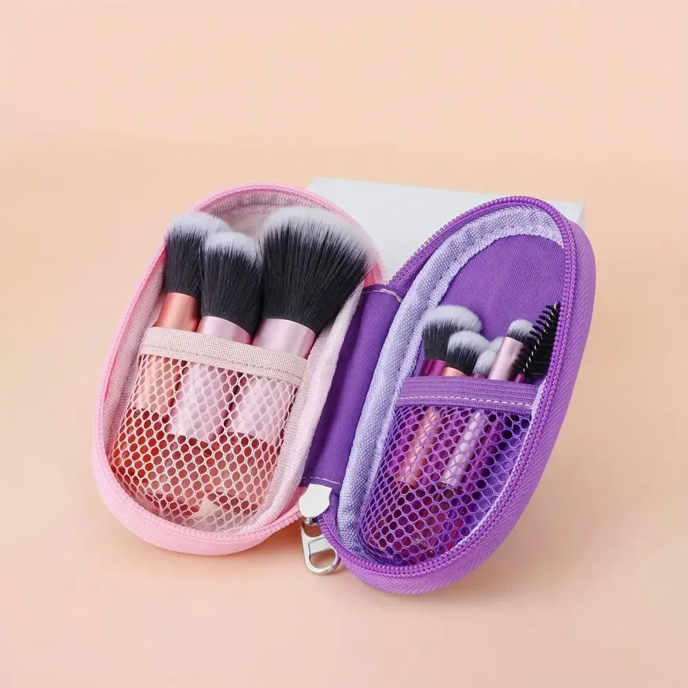 Two compact makeup brush sets in pink and purple zippered cases.