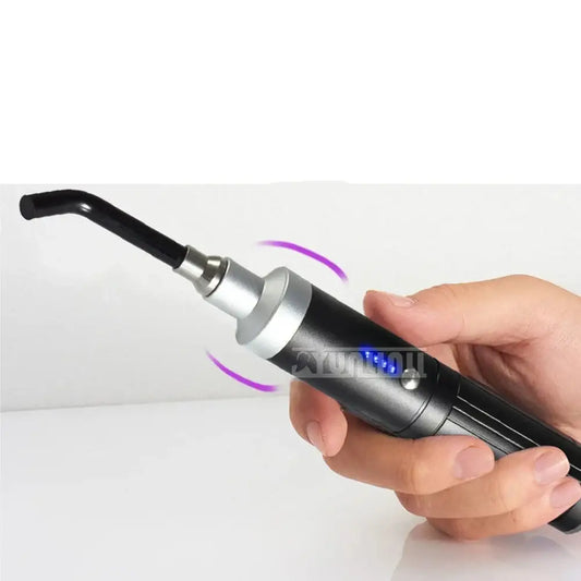 Handheld electric hair curling iron with a curved barrel and digital display.