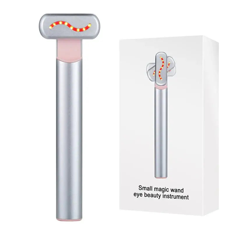 Sleek silver wand-like device with a rounded top containing orange illuminated dots.