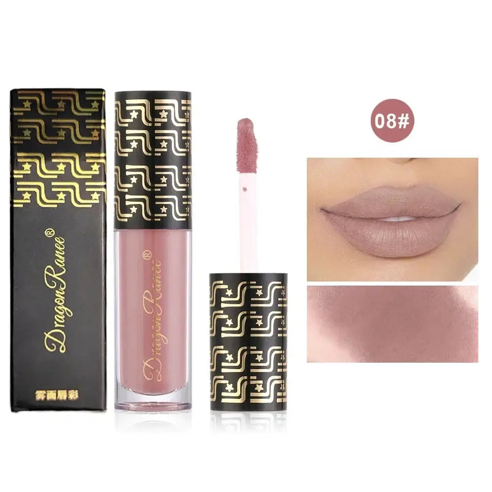 Lip gloss product with packaging featuring a geometric pattern and swatches showing the color.