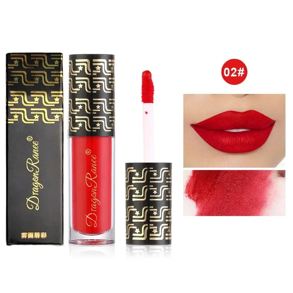 Red liquid lipstick with ornate gold and black packaging.