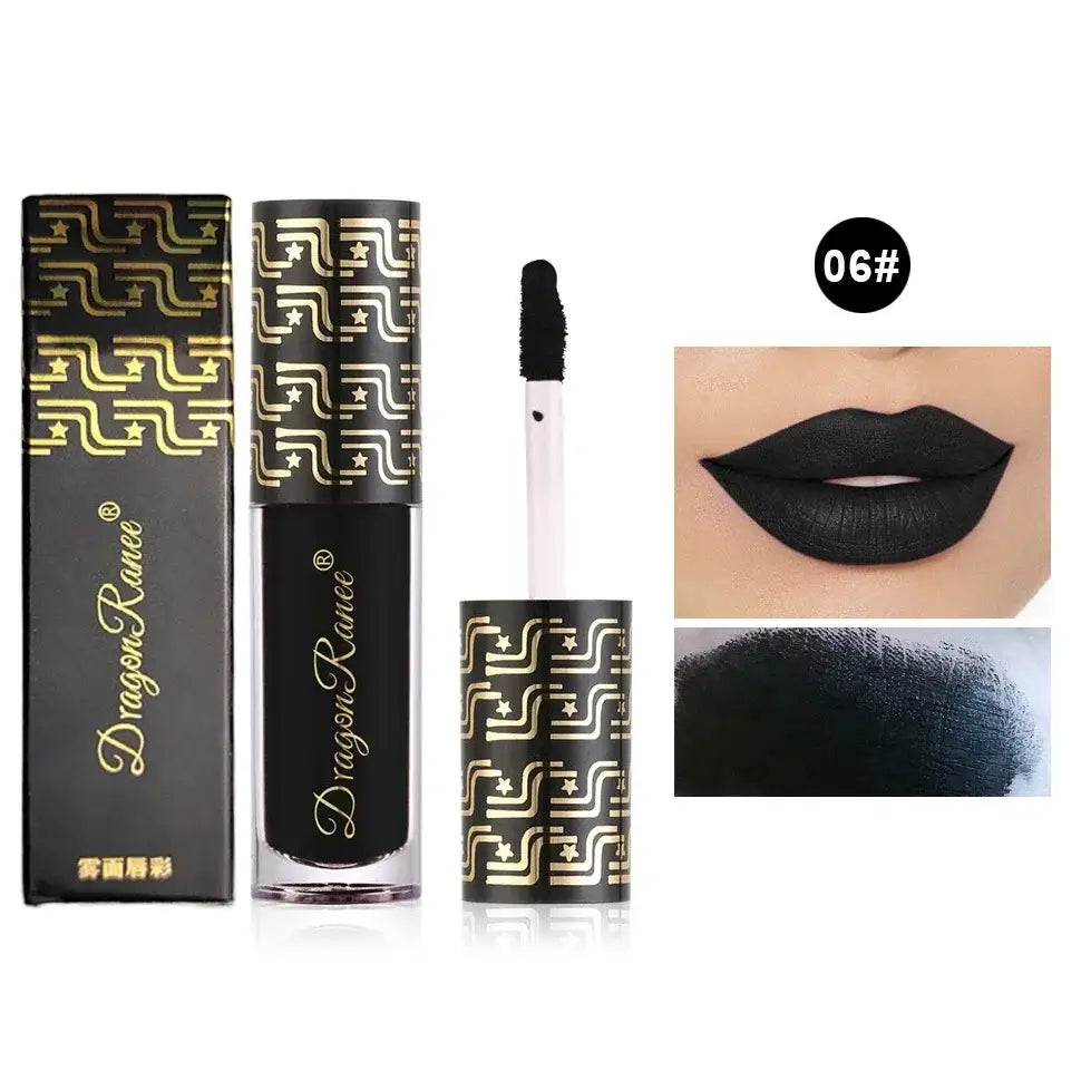 Black liquid lipstick in a tube with gold geometric pattern packaging.