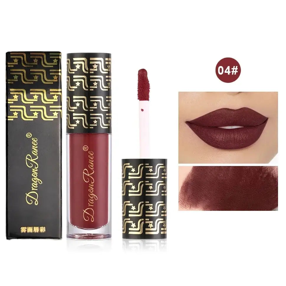 Liquid lipstick in a tube with gold geometric pattern packaging.