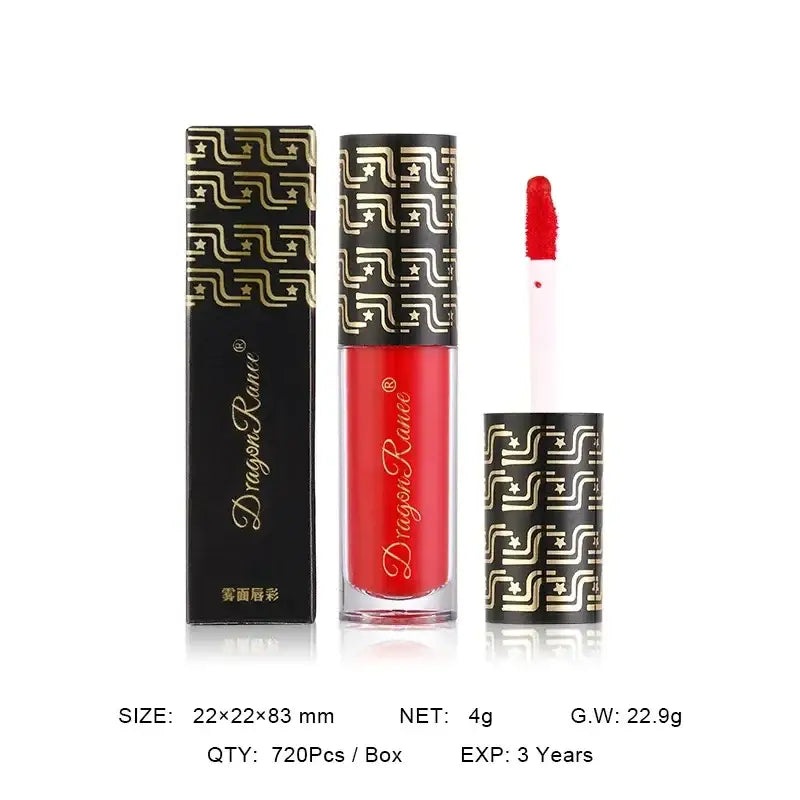 Red liquid lipstick in a tube with ornate gold and black geometric patterned packaging.