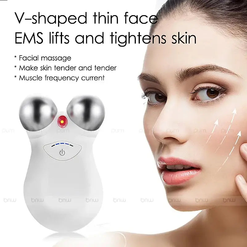 Handheld facial massage device with two metal spheres and a central red light.