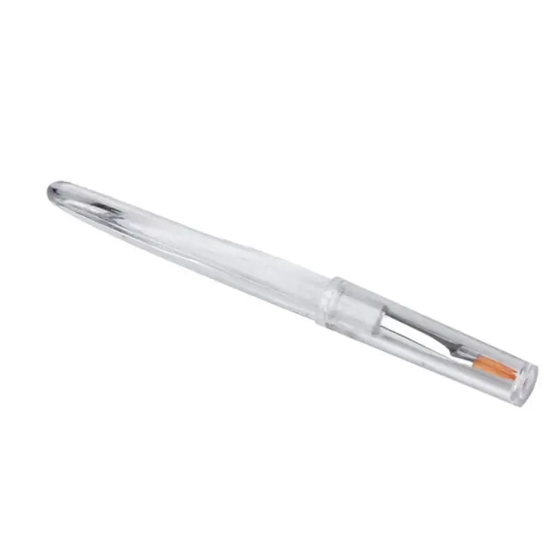 Clear plastic pen or marker with an orange tip visible inside.