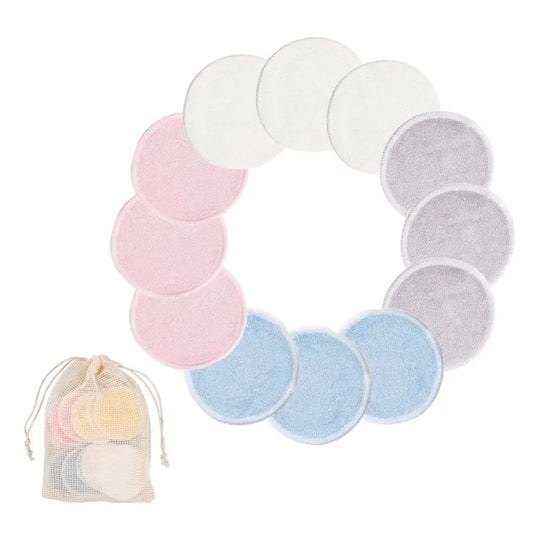 Circular arrangement of pastel-colored reusable makeup remover pads with a small drawstring bag.