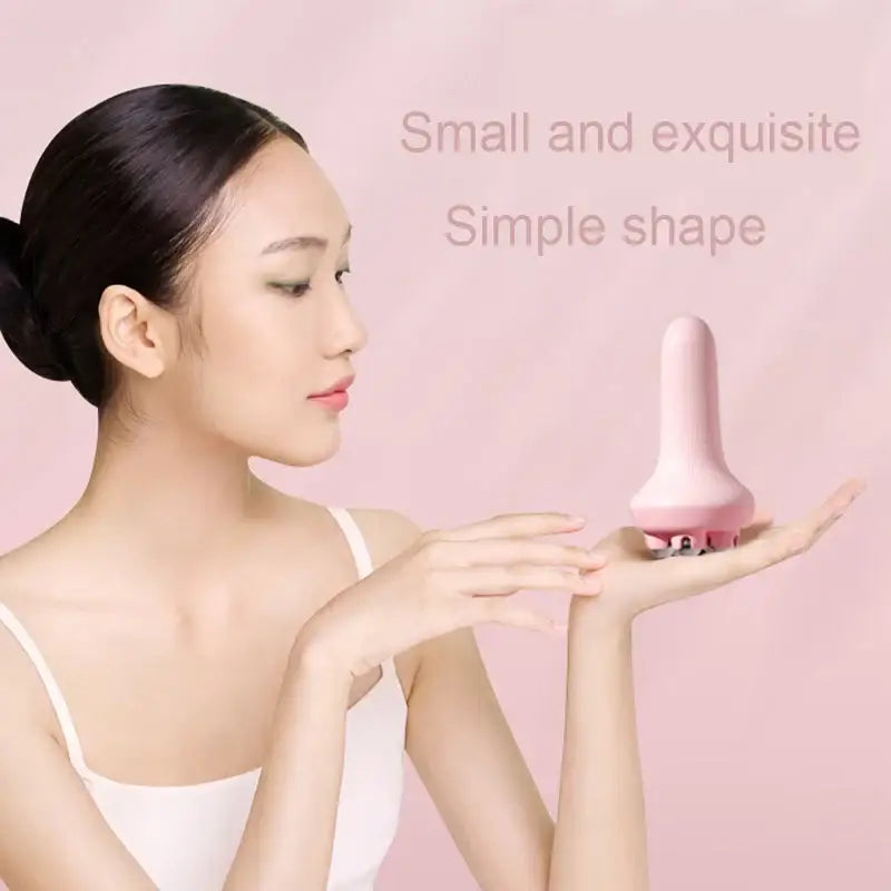 Pink, mushroom-shaped personal massager or beauty device.