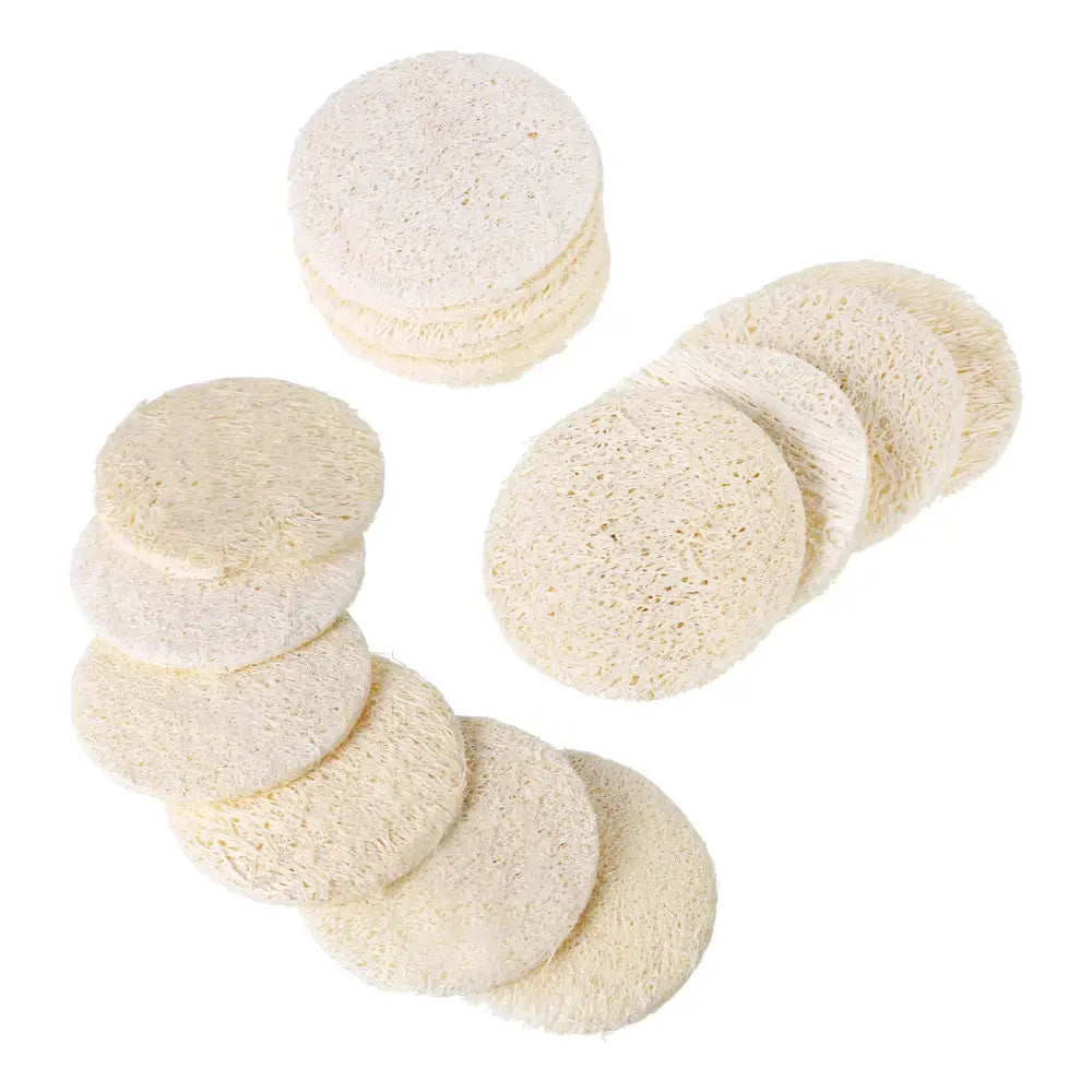 Circular, off-white sponges or pads arranged in scattered groups.