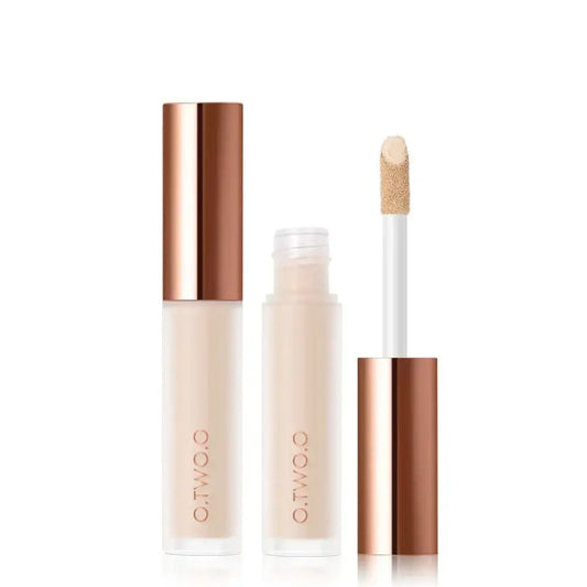 Concealer or liquid foundation makeup product with a wand applicator and rose gold packaging.