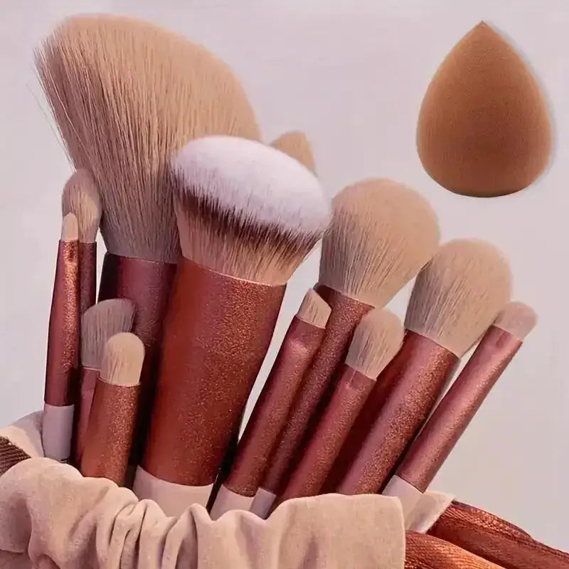 Set of makeup brushes with rose gold handles and soft bristles.