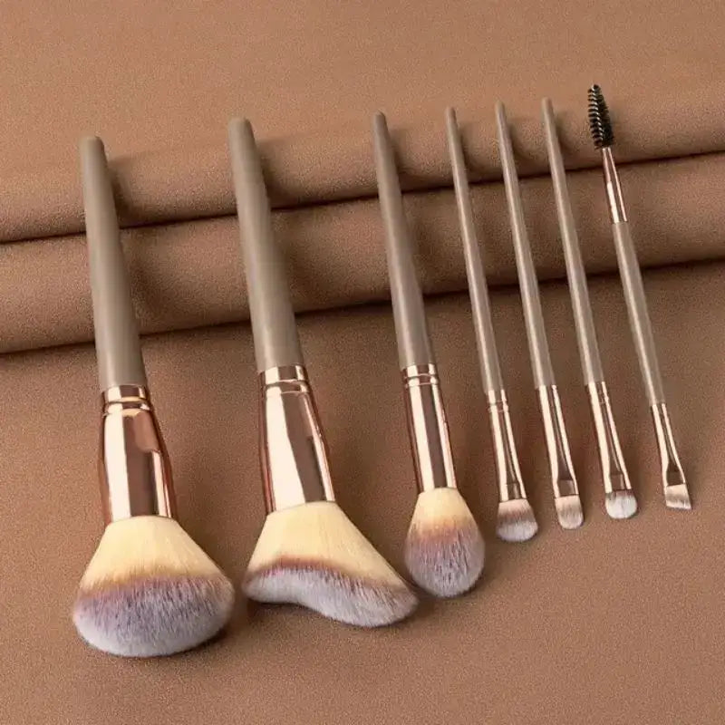 Set of makeup brushes with varying sizes and shapes for different cosmetic applications.