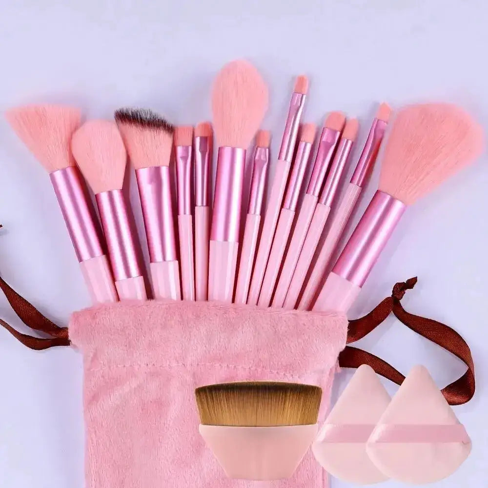 Set of pink makeup brushes with a matching pink brush holder or bag.