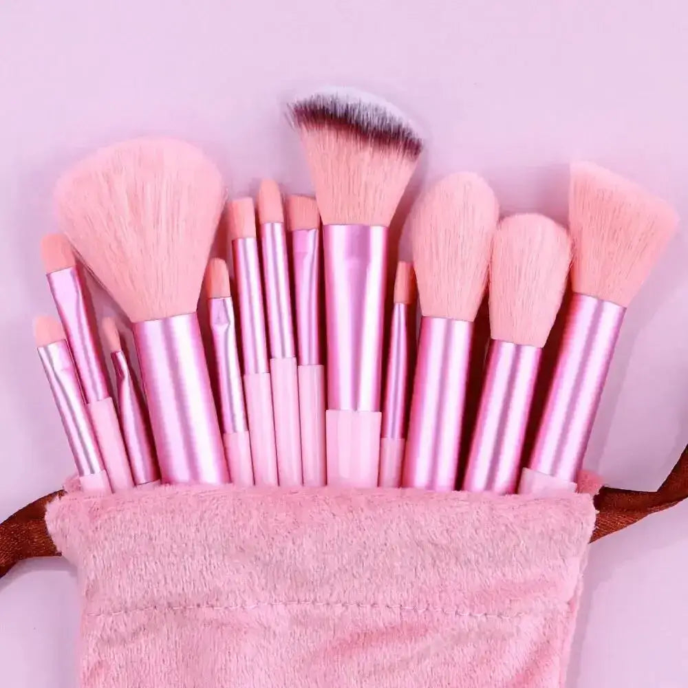 Set of pink makeup brushes in a fuzzy pink holder.