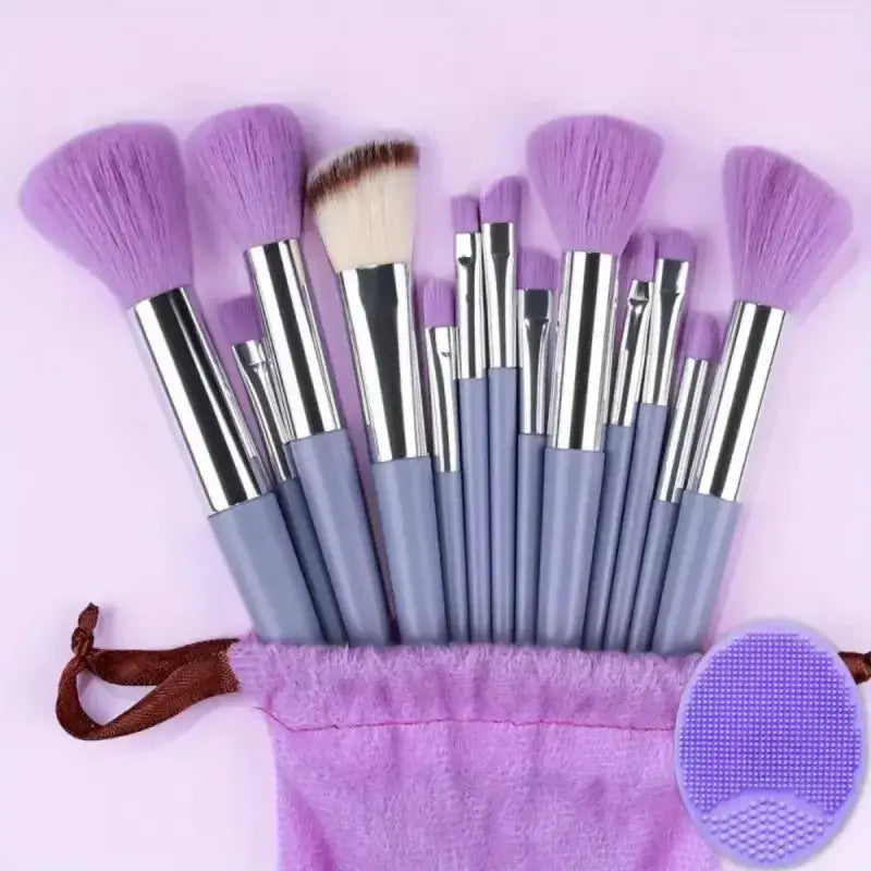 Set of purple and silver makeup brushes with a matching storage pouch.