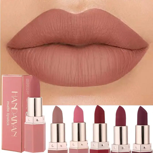 Close-up of full lips wearing matte nude lipstick.