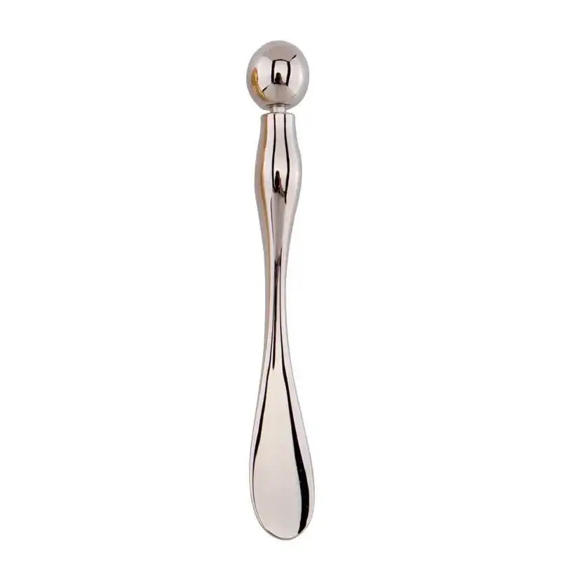 Metallic spoon-like tool with a spherical end and elongated handle.