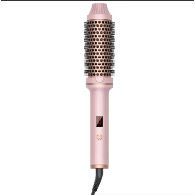 Pink metallic hair styling brush with a cylindrical barrel and attached handle.