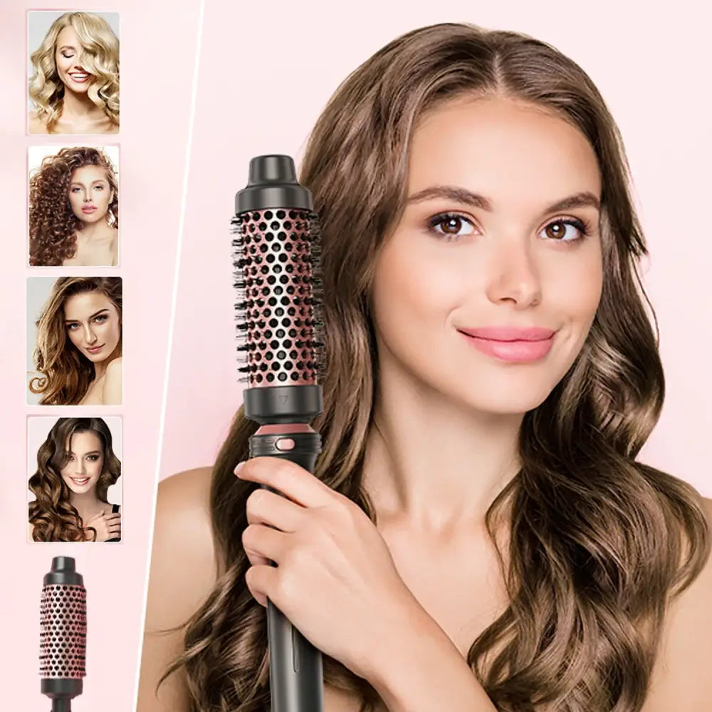 Woman holding a round hair styling brush with a smile.