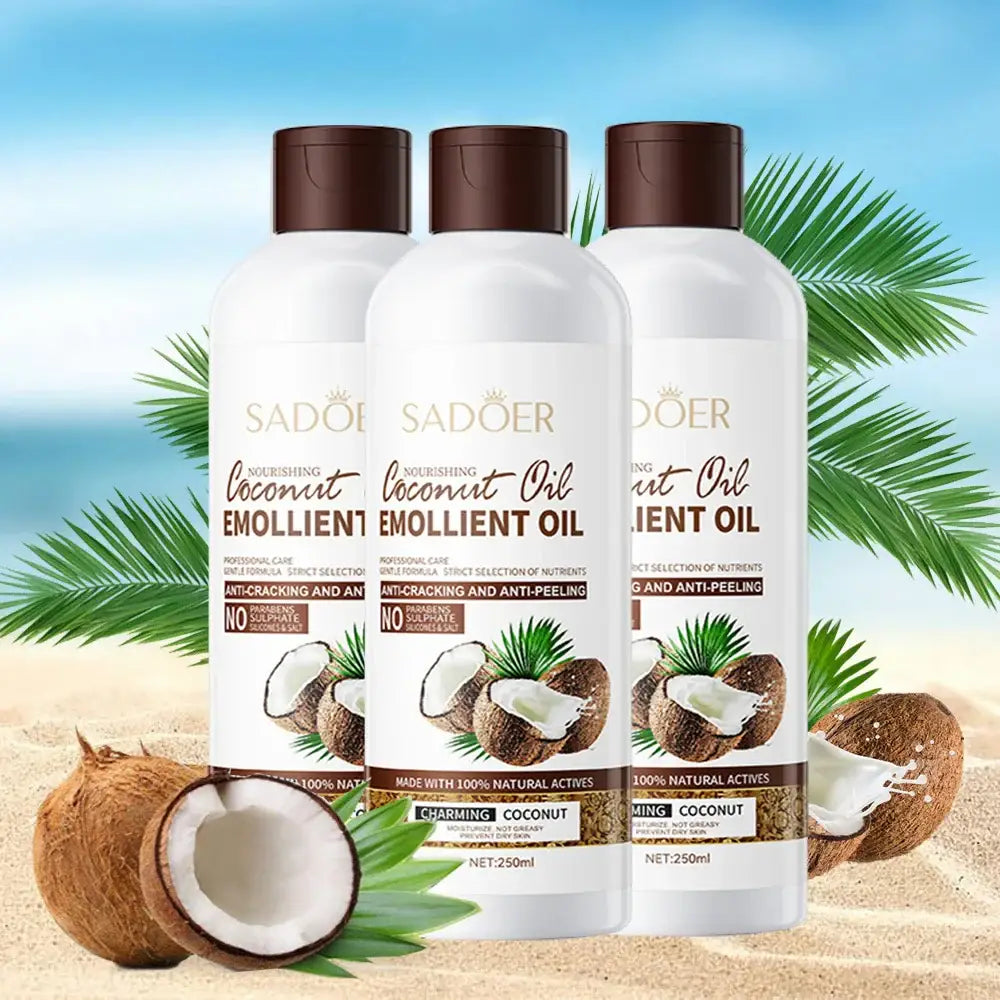 Three bottles of Sadoer coconut emollient oil displayed on a beach setting with coconuts.